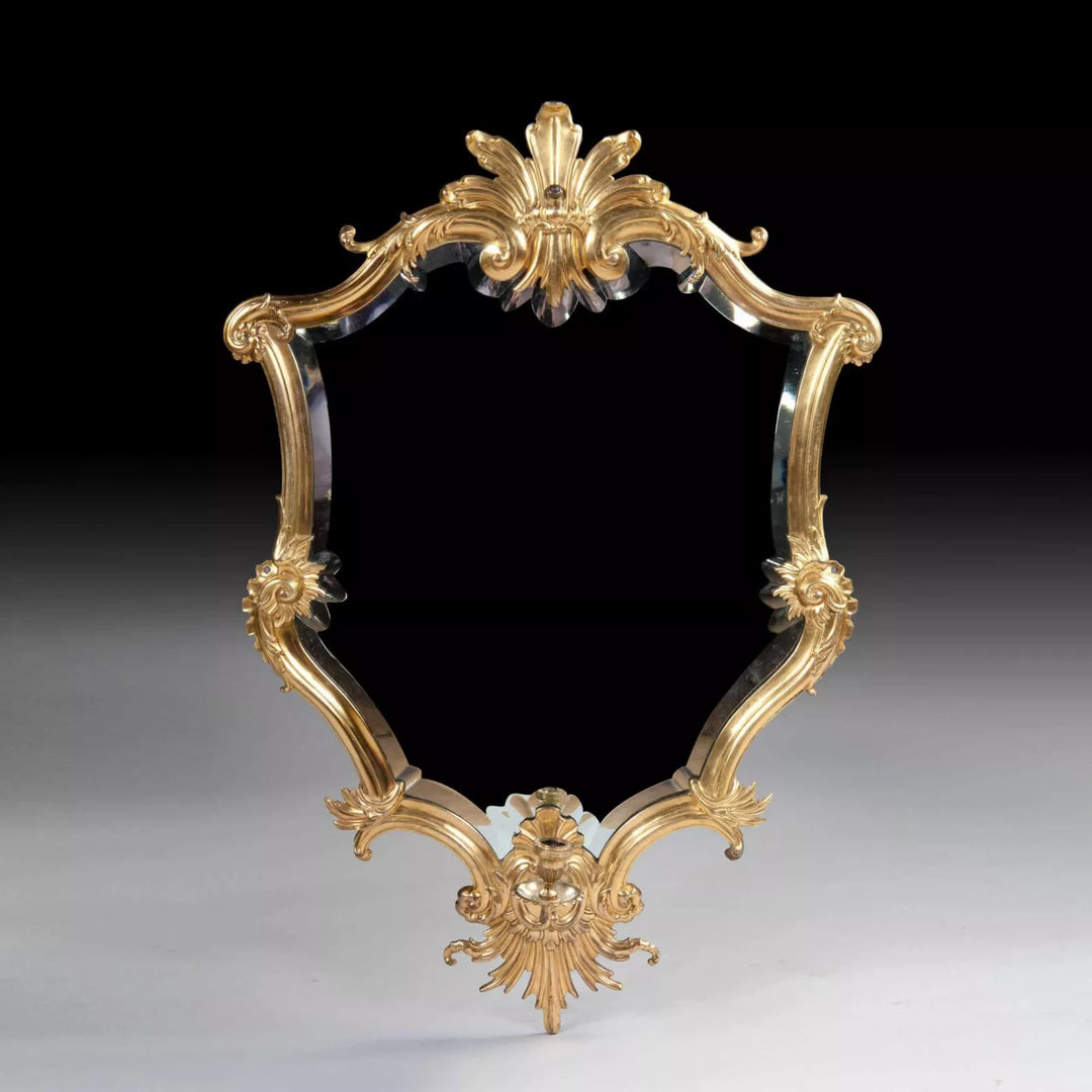 Rare Italian Gilt Bronze Metal Girandole Mirror with elaborate scrolls and stylised anthemion, circa 1750, 94 x 61 cm.