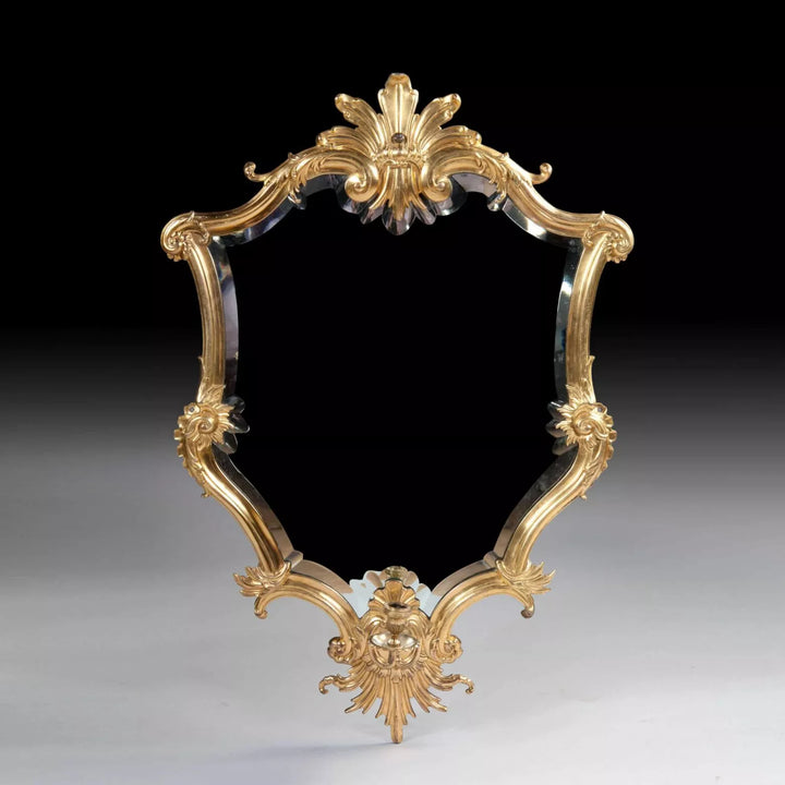 Rare Italian Gilt Bronze Metal Girandole Mirror with elaborate scrolls and stylised anthemion, circa 1750, 94 x 61 cm.