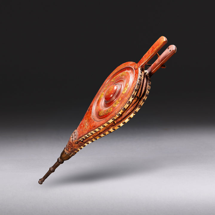 Elegant japanned and gilt-decorated fireplace bellows by Collection TH30 with raised circular boss detail