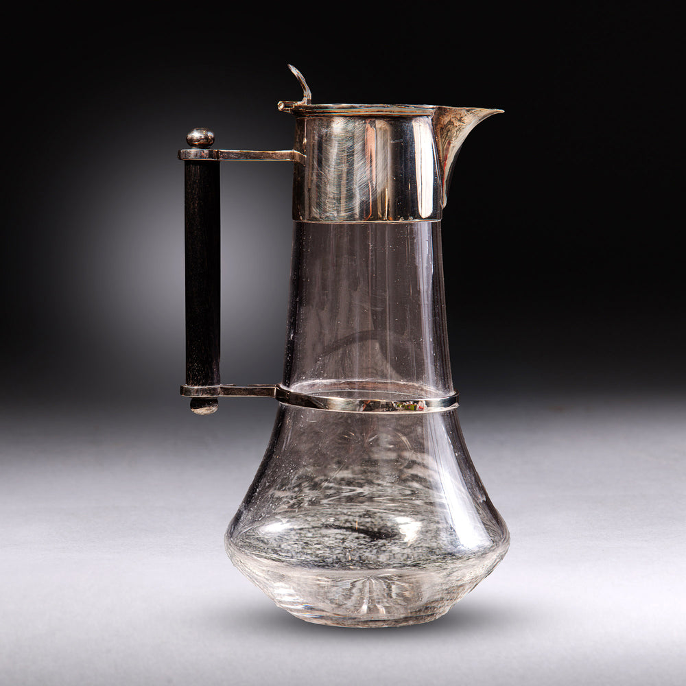 Elegant glass and silver plated claret jug with wooden handle by Collection TH30, designed by Dr Christopher Dresser