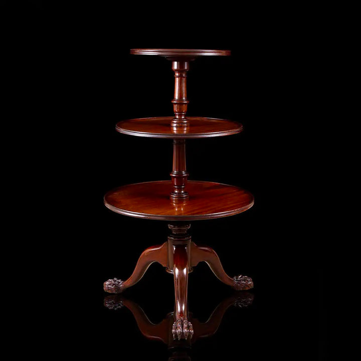 George II Mahogany Revolving Dumbwaiter with three tiers and hairy paw feet, mid-18th century Chippendale style.
