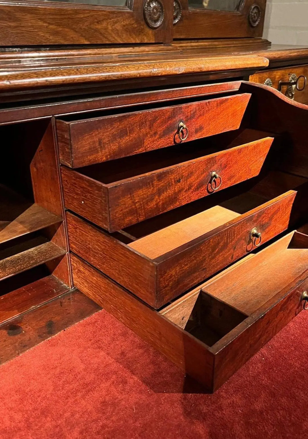Ince and Mayhew George III Secretaire Breakfront Bookcase open drawers showing mahogany interior details and craftsmanship.