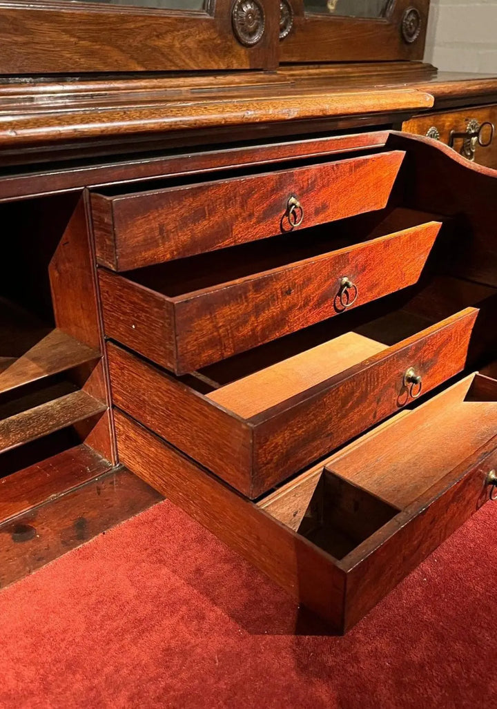 Ince and Mayhew George III Secretaire Breakfront Bookcase open drawers showing mahogany interior details and craftsmanship.