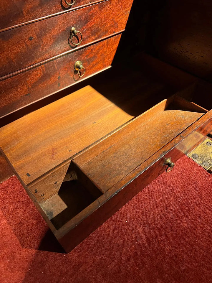 Ince and Mayhew George III Secretaire Breakfront Bookcase open fall front revealing mahogany drawers and pigeon holes interior.