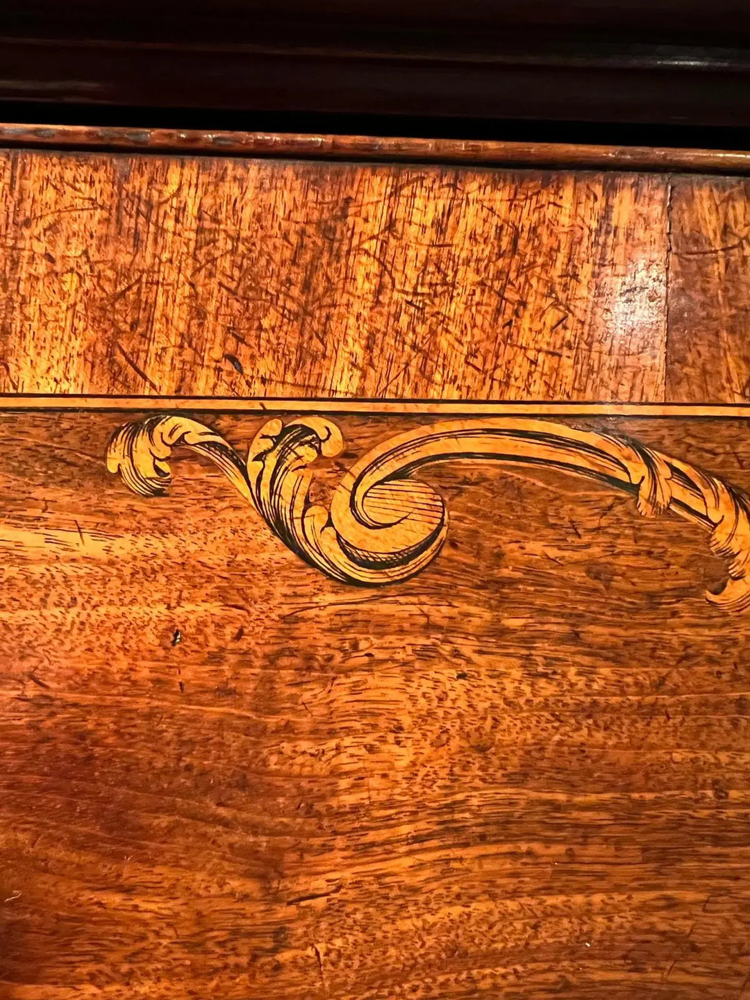 Ince and Mayhew George III Secretaire Breakfront Bookcase detailed mahogany marquetry panel close-up.