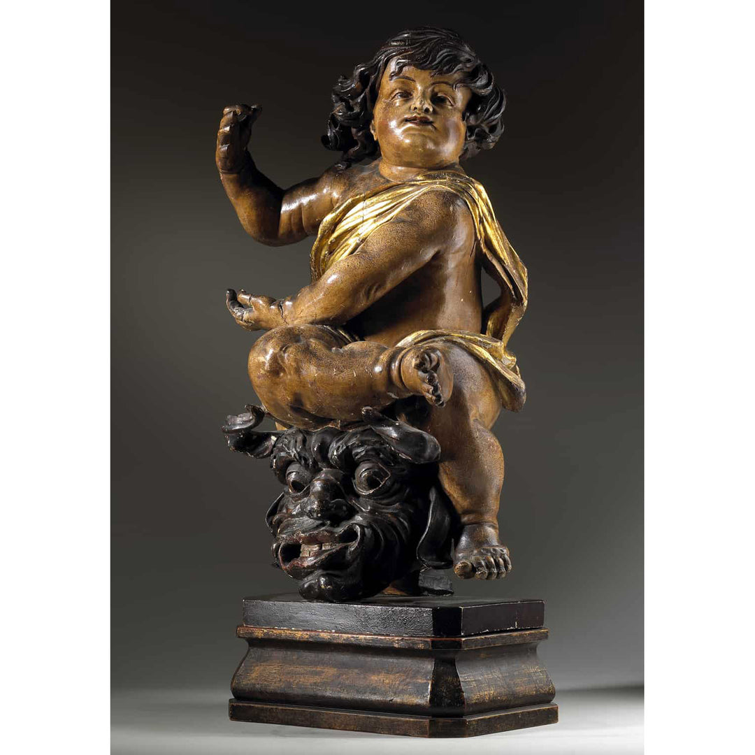Pair of 17th Century North European Baroque Cherubs, carved wooden cherub with gilt drapery on ornate base circa 1640.
