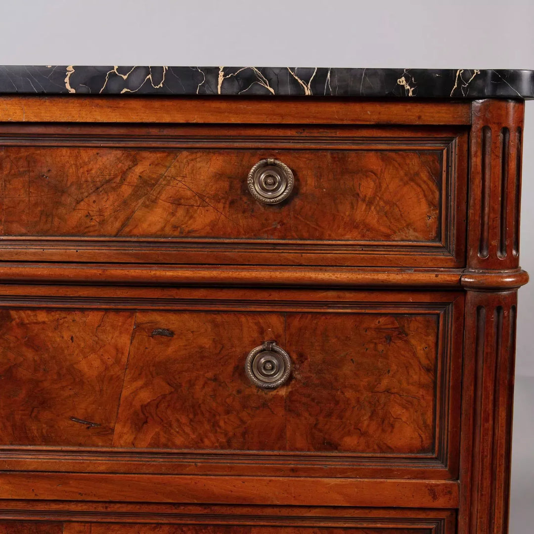A French provincial Louis XVI commode ||| with burr walnut veneer and Nero Portoro marble top, stamped COURTE.