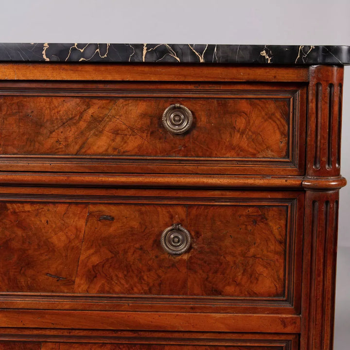 A French provincial Louis XVI commode ||| with burr walnut veneer and Nero Portoro marble top, stamped COURTE.