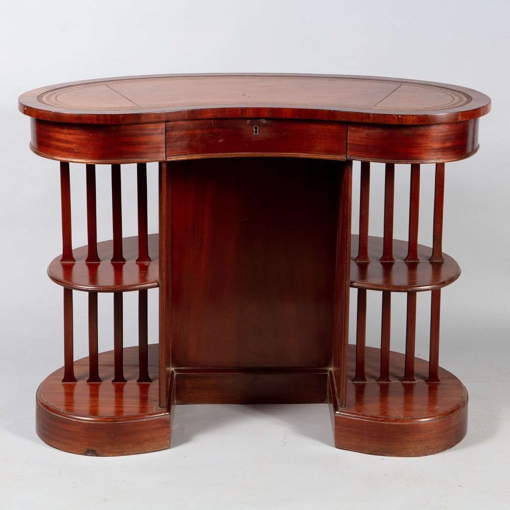 A very unusual Edwardian mahogany skeleton kidney desk with open tiered sides and original leather top circa 1910 England.