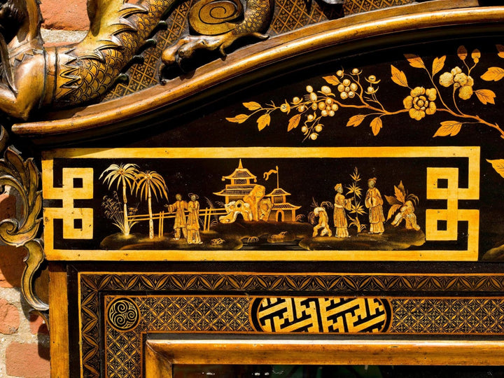 Chinoiserie Black Japanned Overmantel Mirror with gold hatched border and oriental scenes, 19th-century English design.