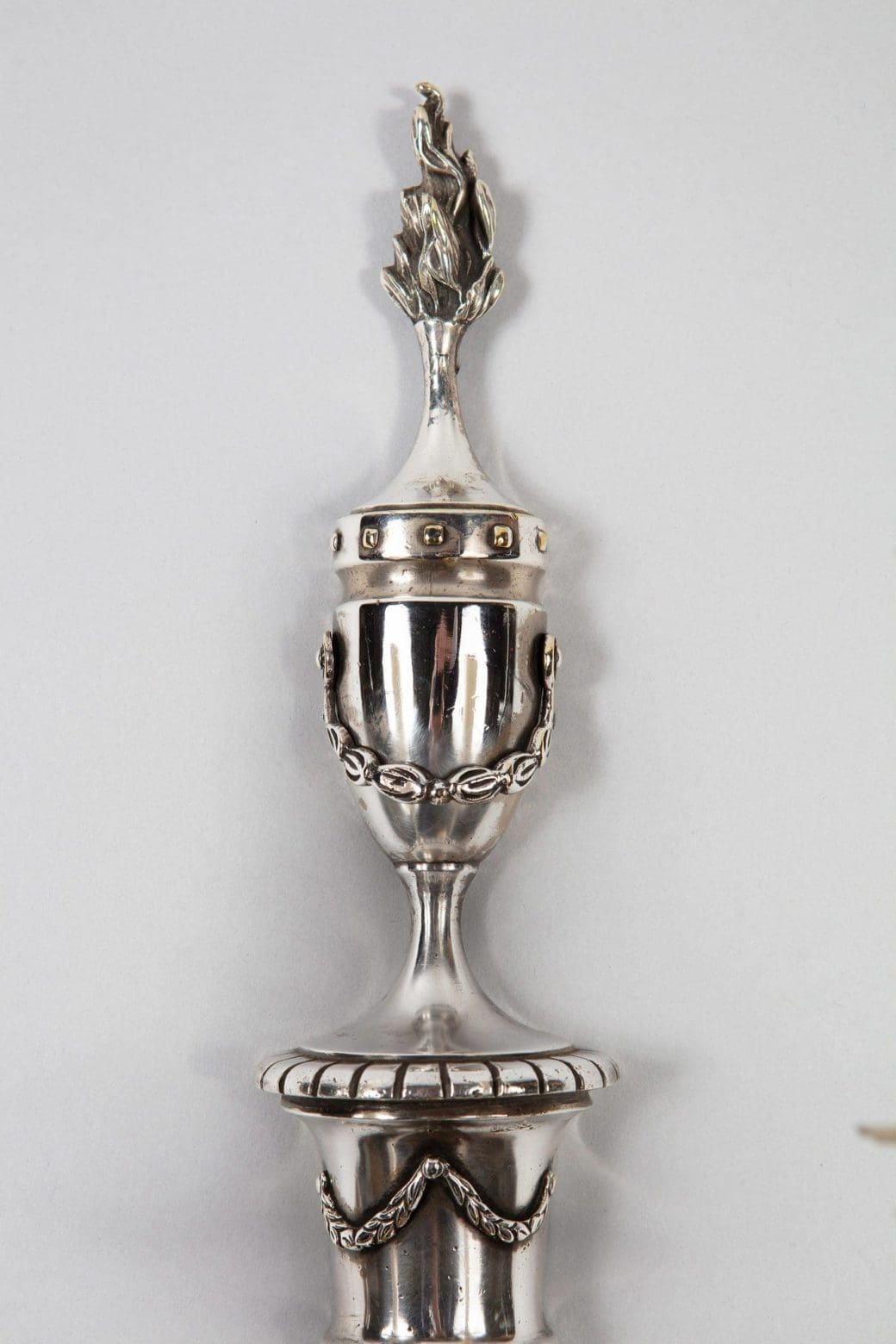 A pair of mid century silver plate wall appliques in the manner of Jansen