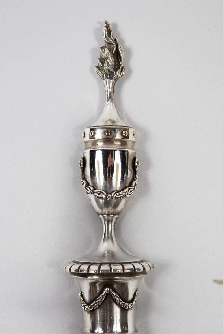 A pair of mid century silver plate wall appliques in the manner of Jansen