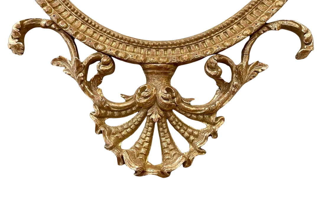 John Linnell Oval Gilt Mirror with intricate carved giltwood detailing, English George III period circa 1775.