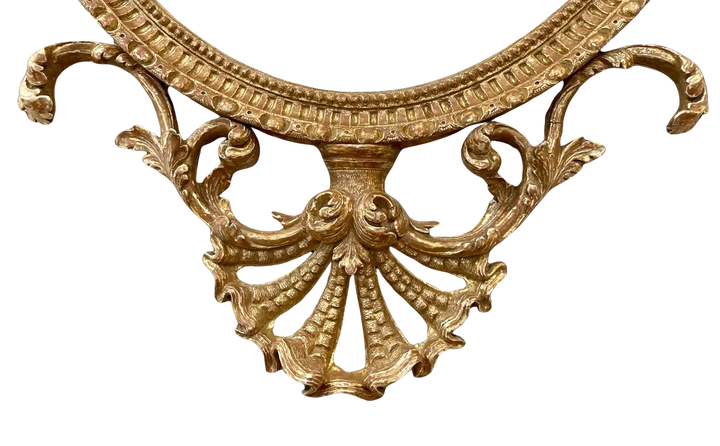 John Linnell Oval Gilt Mirror with intricate carved giltwood detailing, English George III period circa 1775.