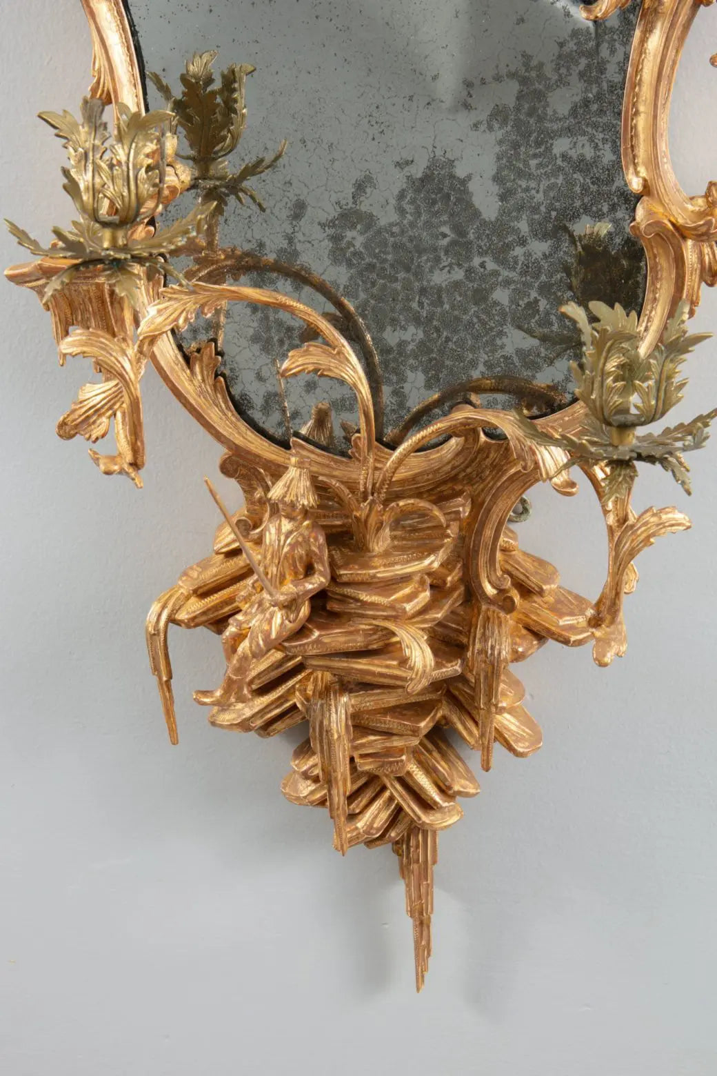 George III Chinese Chippendale Rococo Giltwood Girandole Mirror with ornate giltwood details and a seated Chinaman figure.