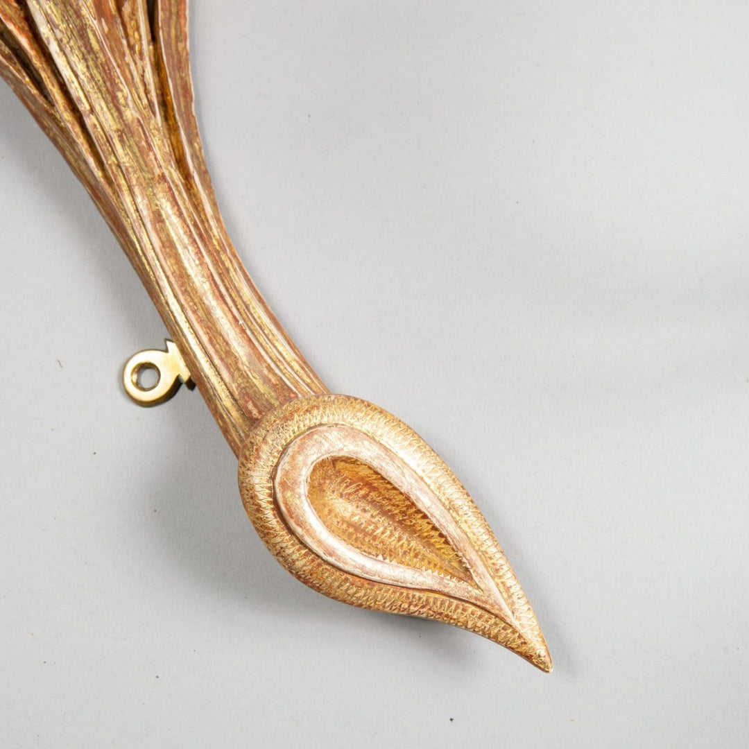 An exceptional pair of carved giltwood wall sconces