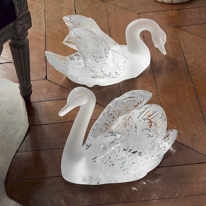 Lalique Head Down Swan crystal glass sculpture on wood floor, paired with Lalique Head Up Swan circa 1980 France.
