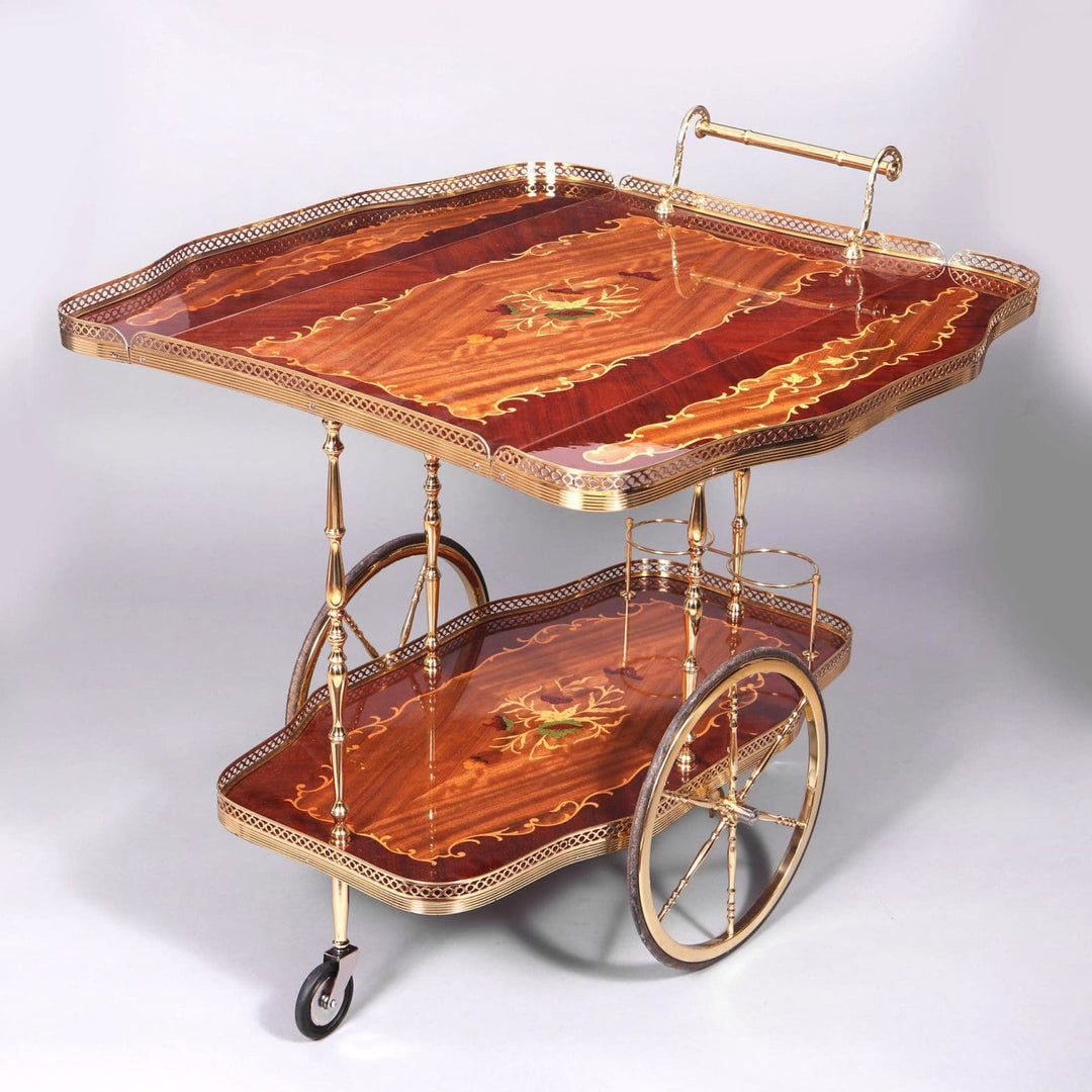 MID CENTURY ITALIAN MARQUETRY DRINKS TROLLEY with marquetry trays, brass legs, large wheels, and drop-leaf design circa 1960.