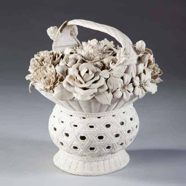 A Continental Biscuit Porcelain Model Of A Basket Of Flowers