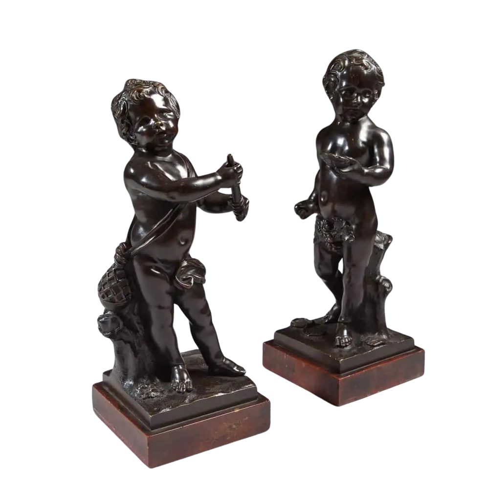 A Pair Of Bronze Cherubs On Marble Bases, 18th-century Flemish sculptures of cherubs with instrument and oyster shell.