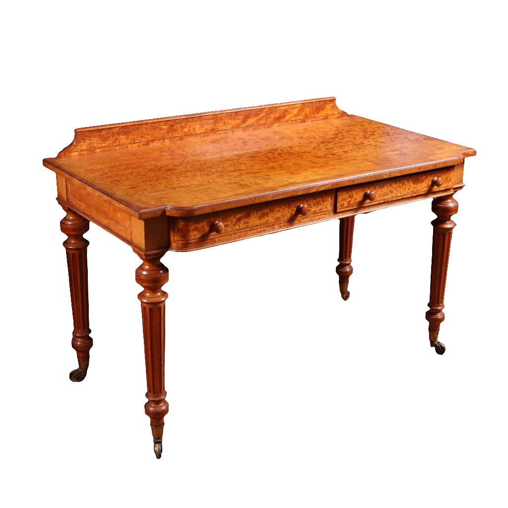 Victorian Satinwood Writing Table by Gillow & Co with figured veneer, two drawers, fluted legs, and brass castors circa 1870.