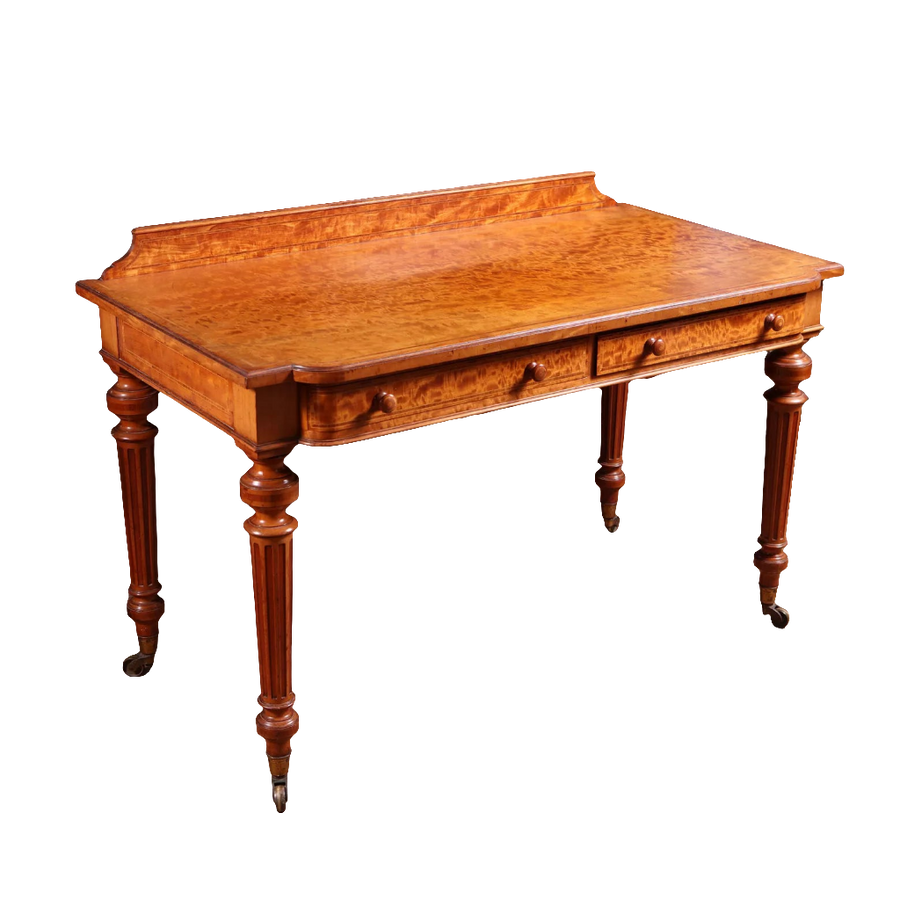 Victorian Satinwood Writing Table by Gillow & Co with figured veneer, two drawers, fluted legs, and brass castors circa 1870.