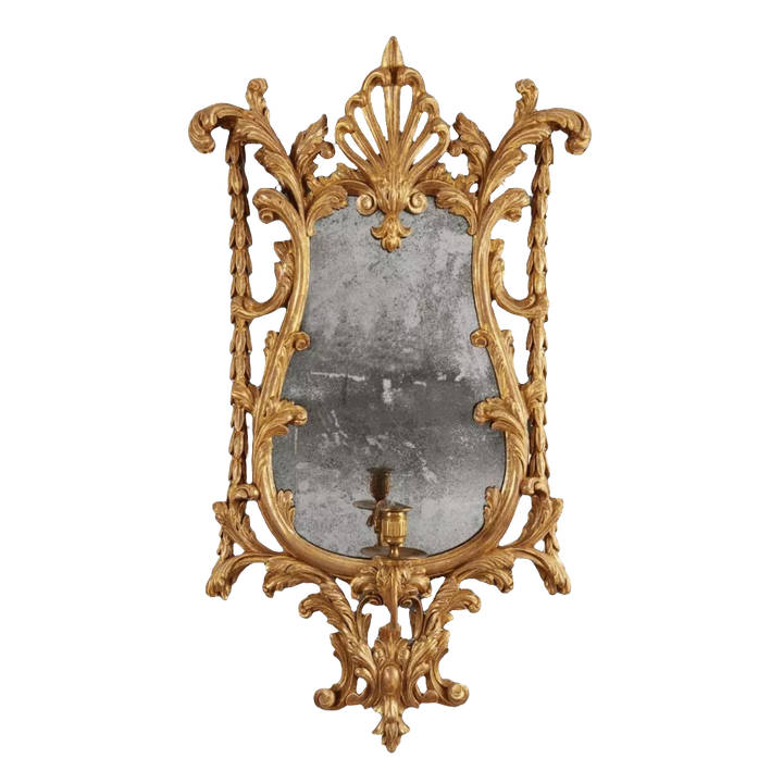 Georgian giltwood girandole mirror with carved anthemion, acanthus leaves, antique mirror plate, and candle arm.