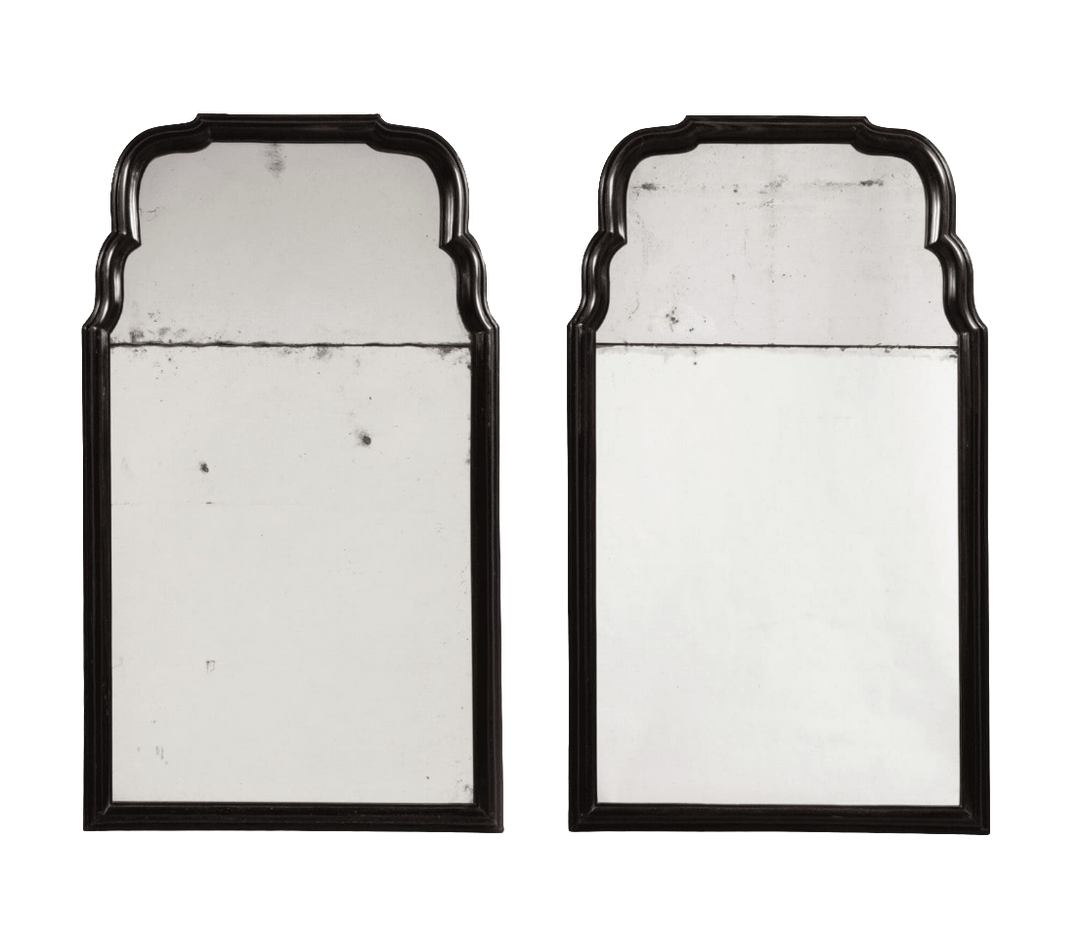Pair of Queen Anne Style Ebony Pier Mirrors with aged mirror plates, solid ebony frames, early 18th-century design.