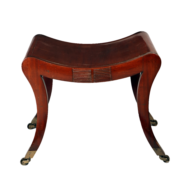 A Regency mahogany sabre legged saddle stool