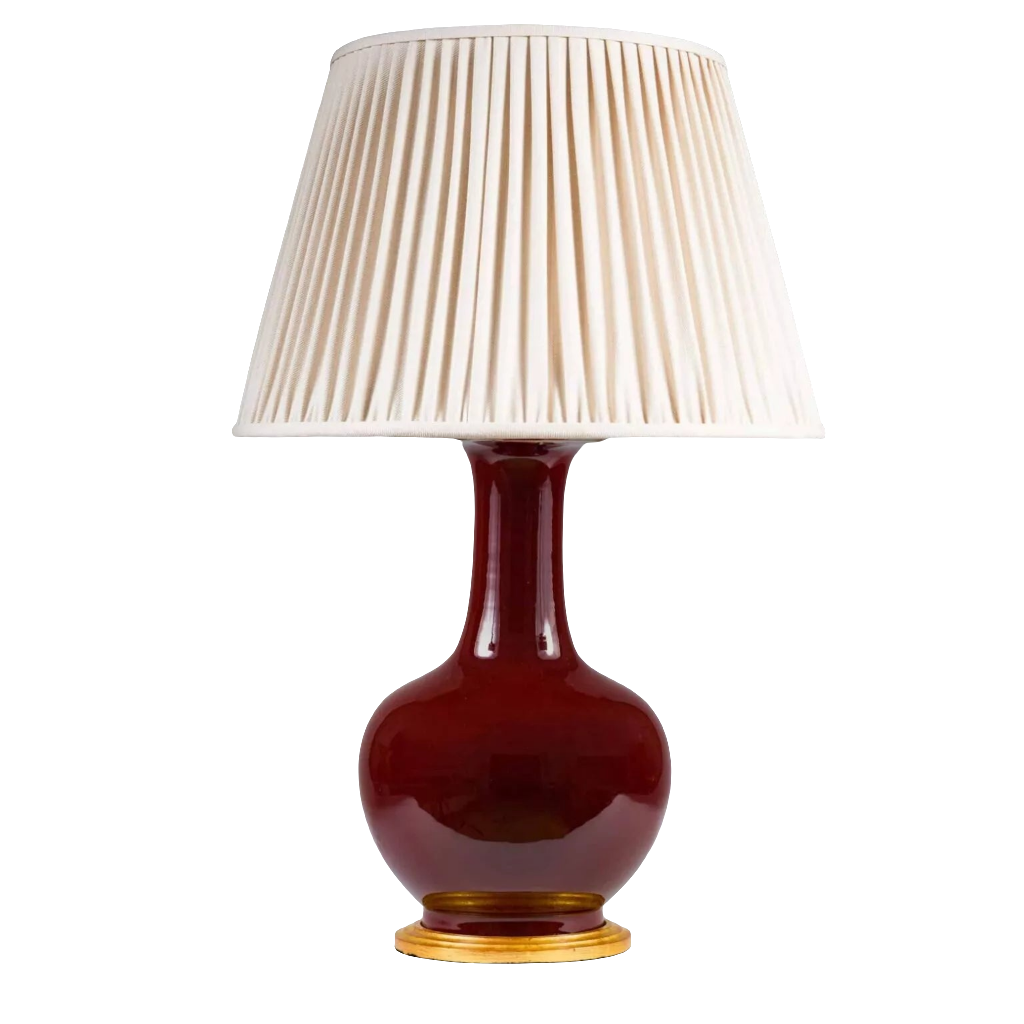Chinese Sang de Boeuf Glazed Vase mounted as a Table lamp with pleated cream shade and gilt wooden base.
