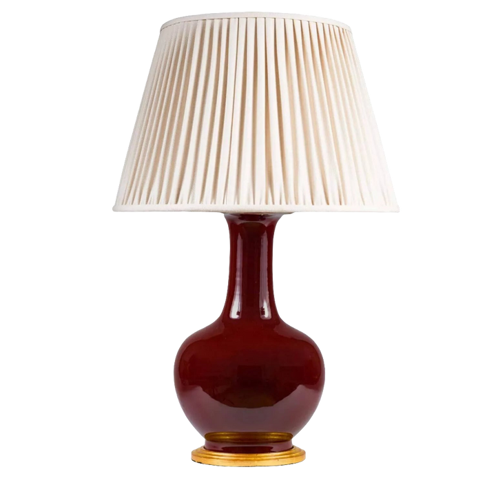 Chinese Sang de Boeuf Glazed Vase mounted as a Table lamp with pleated cream shade and gilt wooden base.