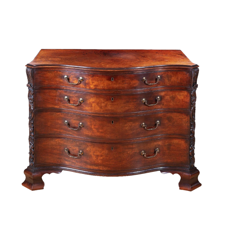 George III Chippendale Mahogany Serpentine Commode with four drawers and carved fruiting vine pilasters, circa 1760.