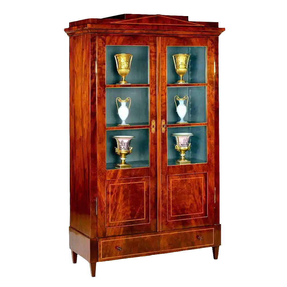 Early 19th Century Berlin Mahogany Armoire with glazed doors, flame veneer, marquetry escutcheons, and painted interior.