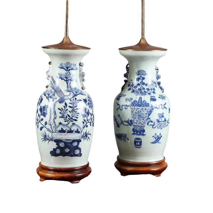 Chinese Blue and white table lamps featuring birds and vases motifs on porcelain with wooden bases, circa 1950.