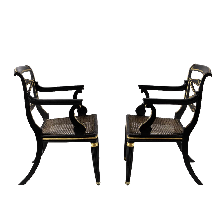 A pair of Regency parcel gilt armchairs