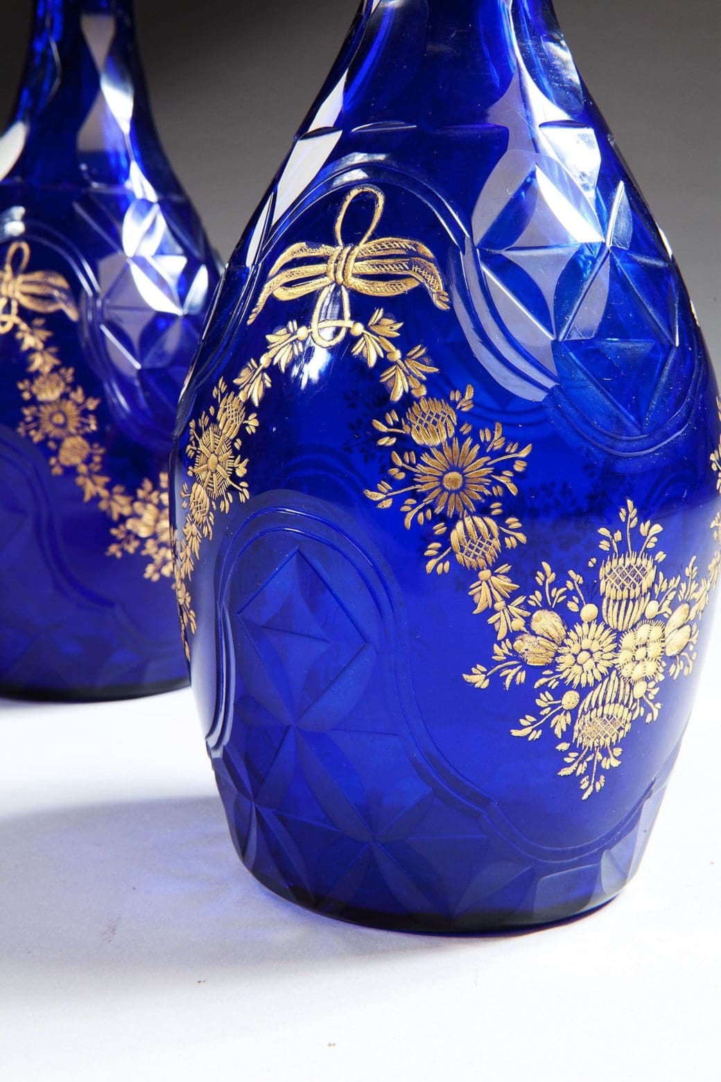 Pair Of Blue Glass Facet Cut Decanters