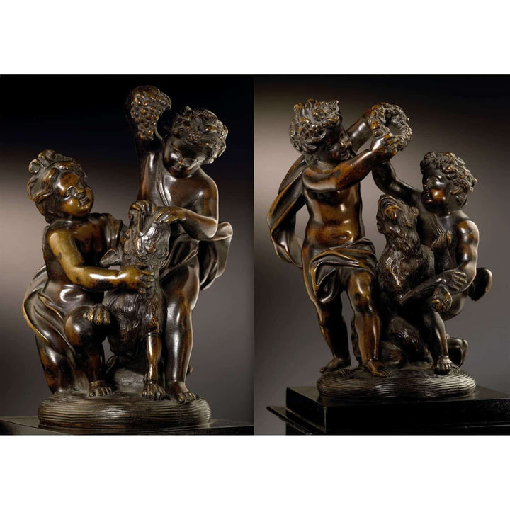 Pair of bronze cherub groups depicting cherubs playing with a dog and monkey, holding garlands and grapes.