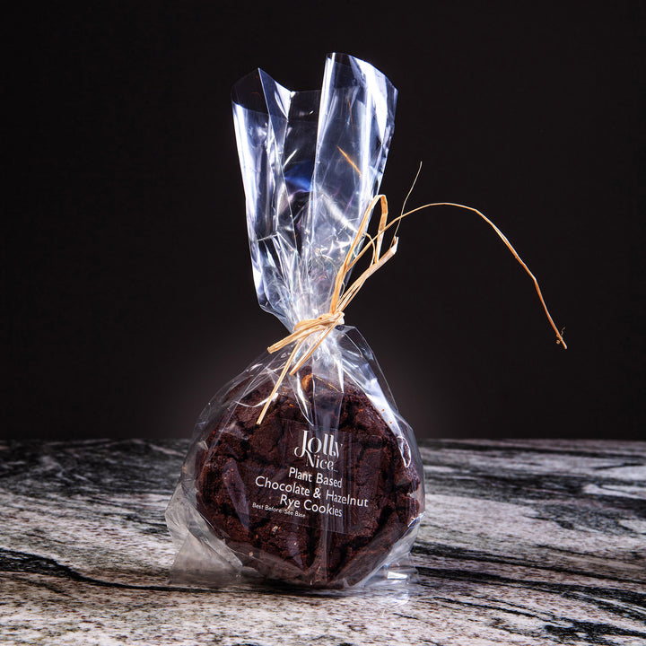Packaged plant-based chocolate and hazelnut rye cookies from Jolly Nice, offered by Nicholas Wells Antiques.