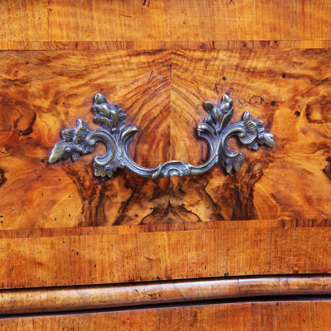 Early 18th Century Italian Walnut Commode with ornate rococo drawer handle and rich walnut veneer panels detail.
