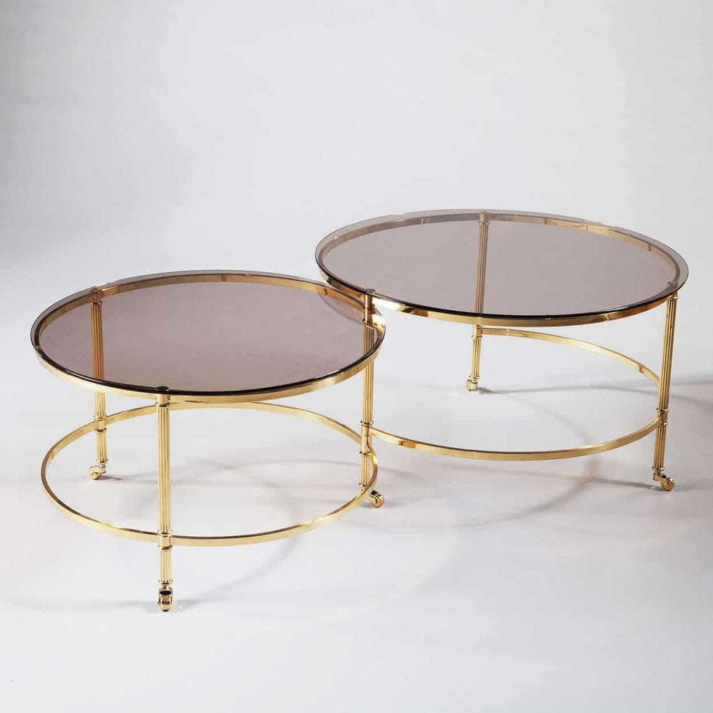 Mid Century Metamorphic Brass Coffee Table with burnished brass frame, smoked glass tops, and rolling second tier extension.