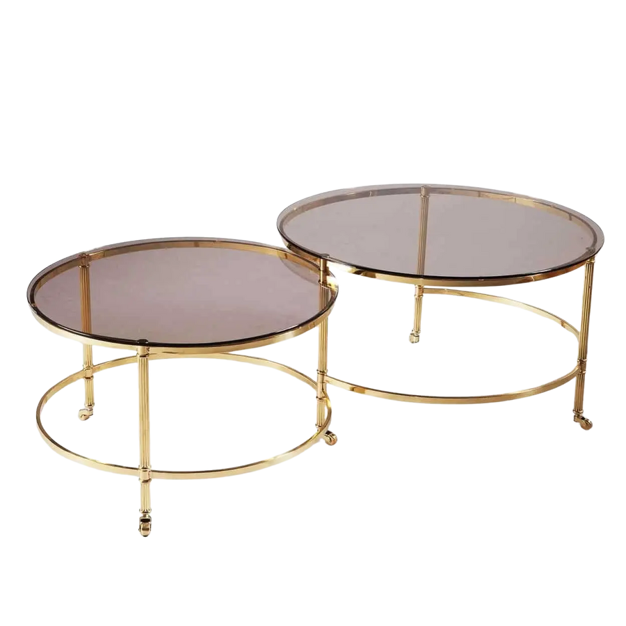 Mid Century Metamorphic Brass Coffee Table with circular smoked glass tops and burnished brass frame on casters.