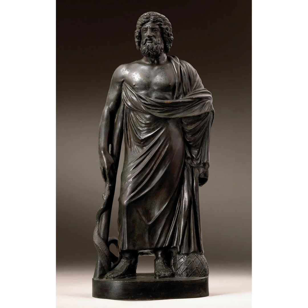 Bronze Figure of Asclepius showing Greek god holding a staff with snake, draped in robes, antique bronze sculpture.