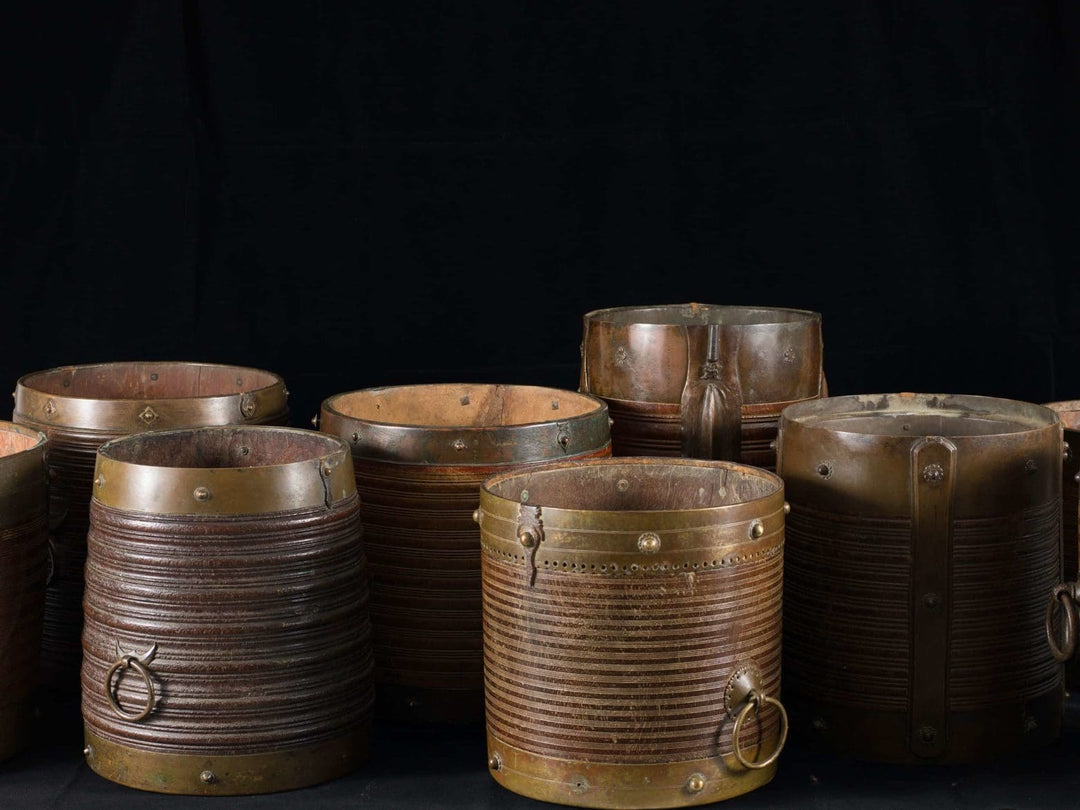 Collection of 9 brass bound rice measures