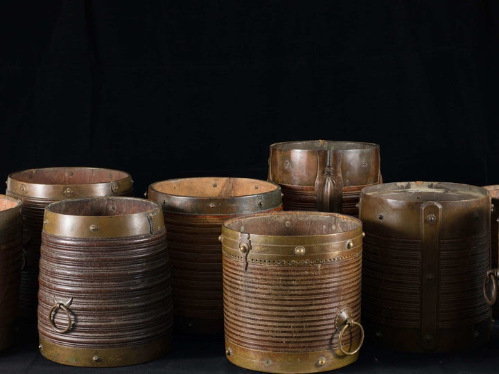 Collection of 9 brass bound rice measures