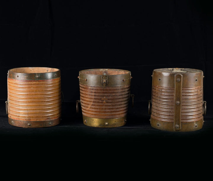 Collection of 9 brass bound rice measures