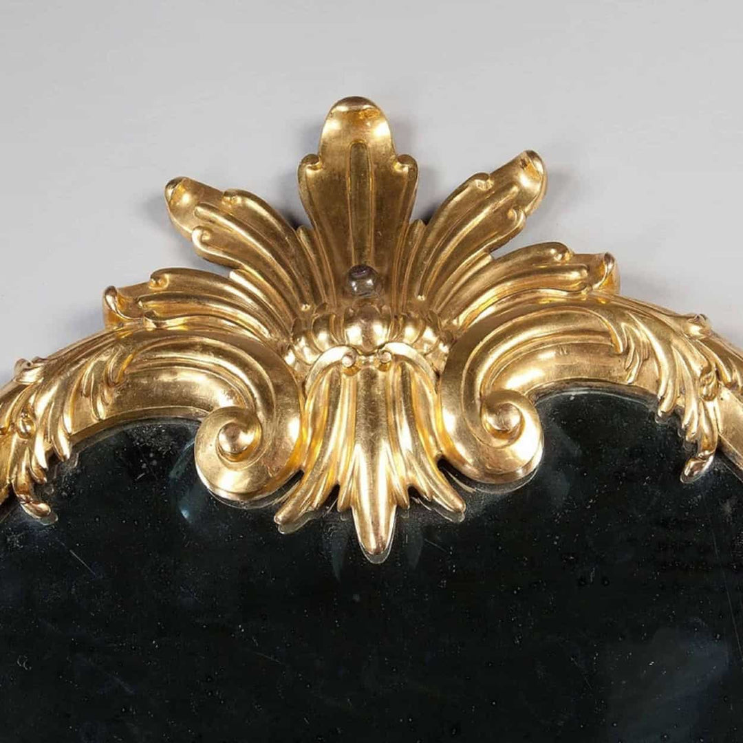 Rare Italian Gilt Bronze Metal Girandole Mirror with elaborate scrolls and stylised anthemion top, circa 1750.