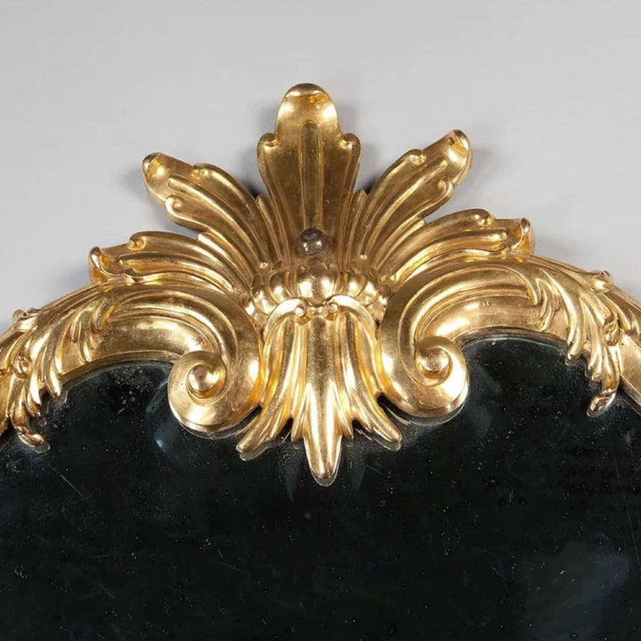 Rare Italian Gilt Bronze Metal Girandole Mirror with elaborate scrolls and stylised anthemion top, circa 1750.
