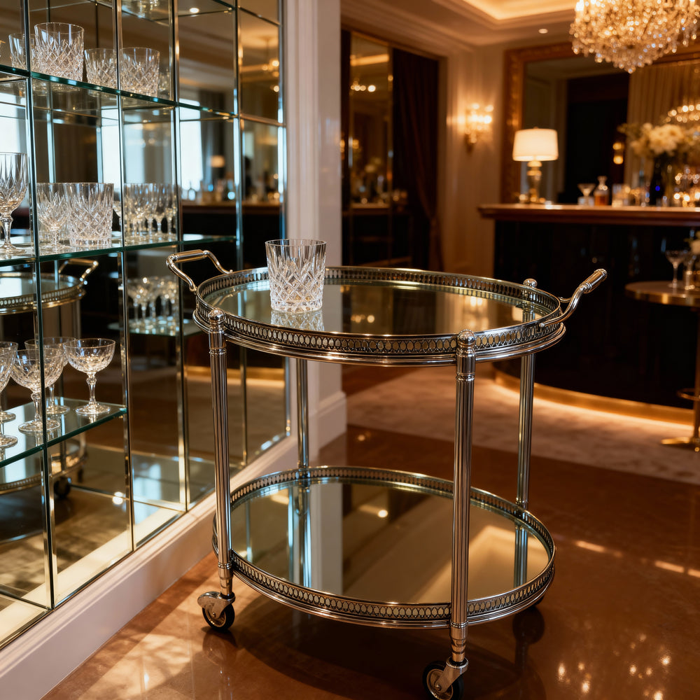 Vintage Maison Jansen drinks trolley in silvered brass with glass shelves by Nicholas Wells Antiques in elegant room setting